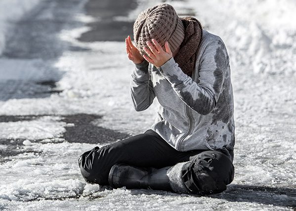slip and fall accident from a woman on an icy road
