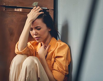 woman with anxiety having a panic attack at work
