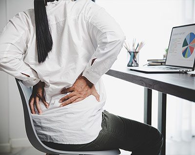 office worker with a back injury dealing with pain