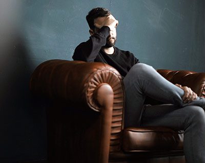 depressed man having trouble at work