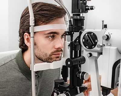 Man having his eyes examined